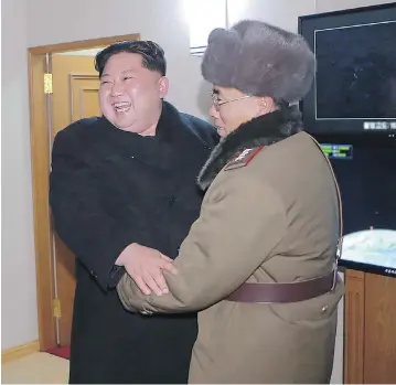  ?? AFP / KCNA VIA KNS / / FILES ?? This image from North Korea’s official Korean Central News Agency shows North Korean leader Kim Jong Un celebratin­g the launch of the Hwansong-15 missile, which he claims is capable of reaching all parts of the United States.