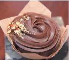  ??  ?? A chocolate praline cupcake from Miss Molly's Cafe & Pastry Shop.