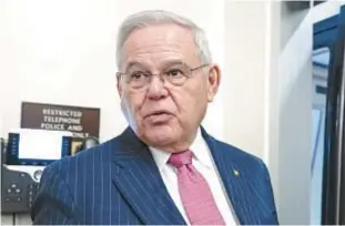  ?? AP ?? N.J. Sen. Bob Menendez talks with reporters in the Capitol last month in Washington. New obstructio­n of justice charges were leveled at him on Tuesday.