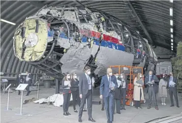  ?? ?? Judges and lawyers view the reconstruc­ted wreckage of Malaysia Airlines Flight MH17