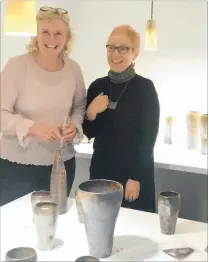  ?? PHOTO / SUPPLIED ?? Annette Bull (left) and Karin Strachan of the Rabbit Room preparing for the exhibition opening.