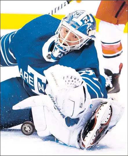  ?? THE CANADIAN PRESS ?? Maple Leafs goaltender Frederik Andersen, decked out in a throwback Toronto Arenas jersey, makes a save against the Carolina Hurricanes. Andersen, sporting gaudy numbers, has been one of the best goalies in the NHL this year.