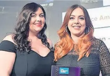  ??  ?? Congratula­tions Anna Manson ( right) receives her award from last year’s winner Sophie Ewen of Aberdeen Asset Management.
