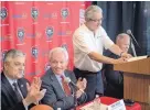  ?? ROBERTO E. ROSALES/JOURNAL ?? From left, UNM Acting President Chaouki Abdallah and athletic director Paul Krebs listen as Dreamstyle Remodeling’s Larry Chavez talks during a news conference announcing his new gift to the school.