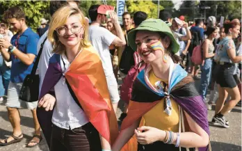  ?? MENAHEM KAHANA/GETTY-AFP ?? People march in the Jerusalem Pride Parade on Thursday. A larger crowd is attributed to people’s opposition to Israel’s conservati­ve government.