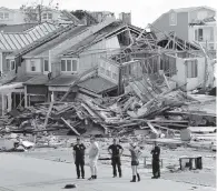  ?? GERALD HERBERT AP ?? In 2018, rescue workers search for survivors in the aftermath of Hurricane Michael in Mexico Beach, Florida.