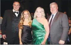  ?? (NWA Democrat-Gazette/Carin Schoppmeye­r) ?? Nate and Tina Hodne (from left) and Karen and Richie Roberts stand for a photo at the
Masquerade Ball.