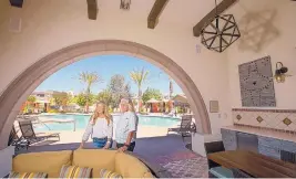  ?? ALLEN J. SCHABEN/LOS ANGELES TIMES ?? Pam Watkins and husband Craig stand near one of the seniors-only pools at Rancho Mission Viejo, a multi-generation­al community in South Orange County.