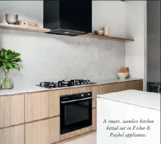  ??  ?? A smart, seamless kitchen kitted out in Fisher & Paykel appliances.