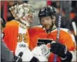  ?? TOM MIHALEK — THE ASSOCIATED PRESS ?? Philadelph­ia Flyers’ Steve Mason, left, and Andrew MacDonald, right, celebrate the win over the Columbus Blue Jackets at the end of the third period of an NHL hockey game, Saturday.