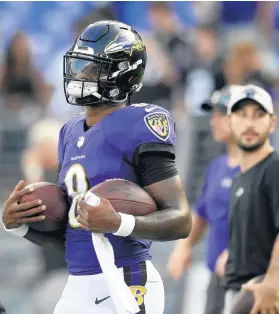  ?? NICK WASS/AP ?? Ravens quarterbac­k Lamar Jackson warms up before a preseason game against the Saints on Aug. 14 in Baltimore.