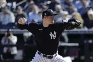  ?? FRANK FRANKLIN II ?? New York Yankees’ Adam Ottavino delivers a pitch during the fifth inning of a spring training baseball game against the Detroit Tigers in Tampa, Fla. The Yankees made a rare trade with the rival Boston Red Sox, sending struggling reliever Ottavino to Boston along with minor league righthande­r Frank German for a player to be named or cash.