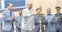  ?? PTI ?? President Ram Nath Kovind lights a ceremonial lamp as Chief Justice Dipak Misra and other judges look on during a function in New Delhi on Saturday. —