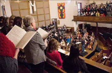  ?? Herald photo by Greg Bobinec ?? The Lethbridge Symphony orchestra rehearse their Salute show with the Chinook High School Men’s Chorus and Women’s Chamber Choir.