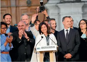  ?? AP ?? Paris mayor Anne Hidalgo, centre, celebrates her re-election after the second round of the municipal election.