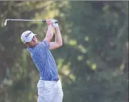  ?? David Dermer / Associated Press ?? Justin Thomas watches his approach on the 16th hole during the third round of the Bridgeston­e Invitation­al.