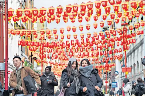  ??  ?? West End landlord Shaftesbur­y, which owns nearly 15 acres of prime London shopping space, including parts of Chinatown, above, said shoppers in the capital continued to spend