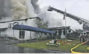  ??  ?? Sperryvill­e Volunteer Fire Department firefighte­r Matthew Cody Dodson takes a muchneeded break Sunday morning after battling the multi-alarm blaze near Boston. A deputy with the Rappahanno­ck County Sheriff’s Office, Dodson was on patrol when the fire...