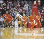  ?? Associated Press ?? Miami’s Jasmyne Roberts (4) and Haley Cavinder (14) react after Miami defeated Indiana, 70-68, in a second-round women’s NCAA Tournament game, Monday, in Bloomingto­n, Ind.