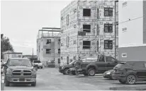  ?? MICHAEL ROBAR • THE GUARDIAN ?? Two other 30-unit buildings are under various stages of constructi­on and will be part of the 90-unit Ironwood Estates on Kensington Road.