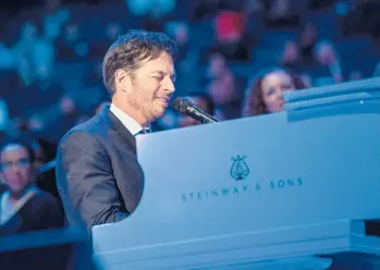 ?? ANDREWBURT­ON/GETTY ?? Harry Connick Jr. sings“How Great Thou Art”prior to a Mass celebrated by Pope Francis in 2015 in NewYork City. The church hymn is among the faith-based songs featured on his recently released album,“Alone With My Faith.”