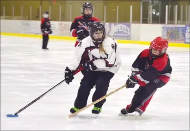  ?? ANDREA PEACOCK/The Okanagan Sunday ?? Ringette players compete in the Sweetheart Tournament in Kelowna on Saturday at the CNC. About 1,300 kids, teens and adults are here for the tournament, which continues today at all available ice rinks in the Central Okanagan. Eighty teams from outside...