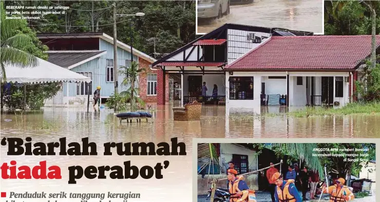  ?? HAFIZ SUHAIMI ?? BEBERAPA rumah dinaiki air sehingga ke paras betis akibat hujan lebat di kawasan berkenaan.