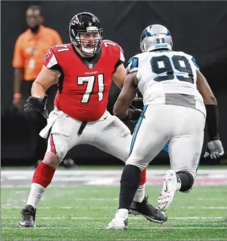  ?? CURTIS COMPTON / CCOMPTON@AJC.COM ?? Falcons guard Wes Schweitzer sets up against the Panthers’ Kawann Short in last weekend’s game in Atlanta. The Falcons won 31-24.