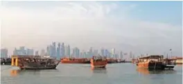  ??  ?? DOHA: A general view shows boats moored in front of the skyline of the Qatari capital, Doha. A Nepalese constructi­on worker in Qatar was ‘sacked’ the day after speaking to a UN delegation visiting the 2022 World Cup host country to examine labor...