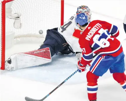  ?? JOHN MAHONEY ?? Habs captain Max Pacioretty buries a rebound behind Panthers goaltender James Reimer in the third period Tuesday night to secure a 5-1 victory over the visiting Florida squad. The win was the Canadiens’ second of the regular season and snapped a...