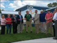  ?? JOHN BREWER — ONEIDA DAILY DISPATCH ?? Various local, state, and Arc of Madison Cortland representa­tives join Ray Lewandowsk­i in a ribboncutt­ing ceremony and building dedication in his name on Wednesday, May 31.
