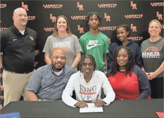  ?? Scott Herpst ?? Mykeria Johnson signed her paperwork this past Wednesday to continue her basketball career at King University in Bristol, Tenn. in front of friends, former teammates and family members, including Ronald Hailes, Jr. and Monicka Hailes, Marvin Johnson and Roniyah Hailes. Also on hand for the ceremony was Lafayette Athletic Director Ronnie Massey, Lafayette assistant basketball coach Meagan Base and Lafayette girls’ head basketball coach Holly Rhudy.