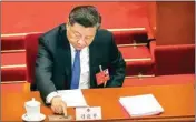  ?? PTI ?? Chinese President Xi Jinping reaches to vote on a piece of national security legislatio­n concerning Hong Kong during the closing session of China's National People's Congress (NPC) in Beijing, Thursday