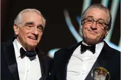  ?? — AFP photos ?? De Niro (above right and right) poses with a Tribute award, next to Director Scorsese during the 17th Marrakech Internatio­nal Film Festival on Saturday.