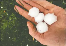  ?? ROB STONE
COURTESY OF ?? Hailstones left golf-ball-sized-dents in Stone’s pickup truck.