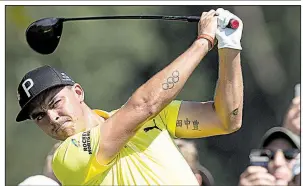  ?? AP/The Philadelph­ia Inquirer/JOSE F. MORENO ?? Rickie Fowler hits from the 10th tee during the first round of the BMW Championsh­ip at Aronimink Golf Club in Newtown Square, Pa. Fowler opened with a 5-under 65 and is in a tie for eighth with three others.