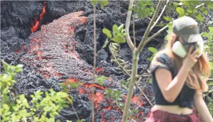  ?? MARIO TAMA/GETTY IMAGES ?? A 17th lava fissure announced Sunday joined another crack that emerged over the weekend as geologists warned of the possibilit­y of a catastroph­ic explosion at the Kilauea volcano’s Halema’uma’u Crater.