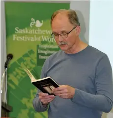  ??  ?? David Richards reads from a book of poetry during historical fiction workshop.