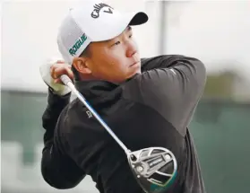  ?? AP FOTO ?? LEADER. 19-year-old Norman Xiong watches his shot on the second tee in the Sanderson Farms Championsh­ip, wherein he’s currently tied with Cameron Champ, and is in contention for the title.