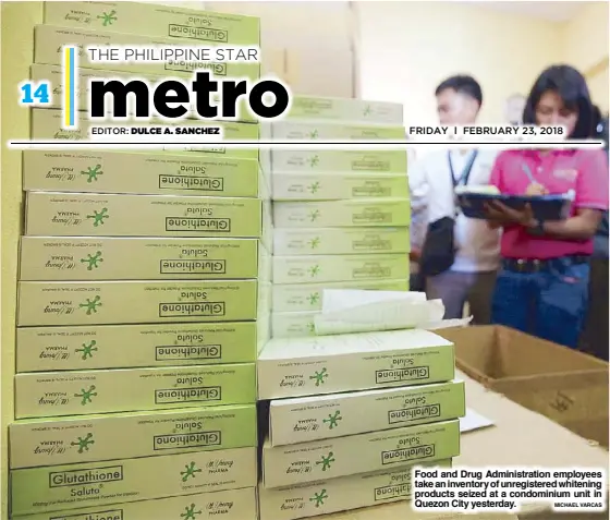 ?? MICHAEL VARCAS ?? Food and Drug Administra­tion employees take an inventory of unregister­ed whitening products seized at a condominiu­m unit in Quezon City yesterday.