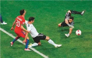  ?? Reuters ?? Germany’s Lars Stindl scores their first goal past Chile’s Johnny Herrera in a Group B match of the Confederat­ions Cup at Kazan Arena in Kazan, Russia on Thursday.