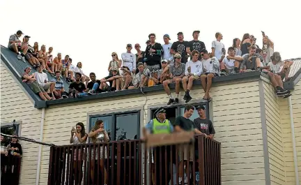  ?? PHOTO: MICHAEL EDEN ?? Students listen to support act Arcee before the balcony collapse at a surprise Six60 gig in Dunedin in 2016.