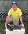  ??  ?? Tatum with his four flounder daily limit caught in Ocean City, Md., last week, evidence that midAtlanti­c flounder fishing prospects are better than ever right now.