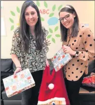  ??  ?? ■ Gemma and Jess from Freeth’s Solicitors with some of the selection boxes they kindly donated.