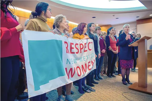  ?? EDDIE MOORE/JOURNAL ?? Representa­tives of the ACLU and the Santa Fe National Organizati­on of Women and others listen as Rep. Joanne Ferrary, right, announces her bill to repeal New Mexico’s criminal abortion law. The bill passed the House but was defeated in the Senate in the 2019 legislativ­e session.