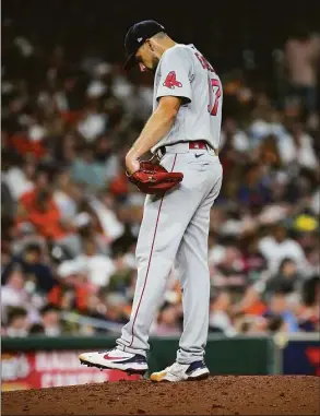  ?? Jon Shapley / Houston Chronicle ?? Red Sox starting pitcher Nathan Eovaldi kicks the dirt on the mound as Astros second baseman Jose Altuve prepares to bat during the fourth inning on Aug. 1 at Minute Maid Park in Houston.