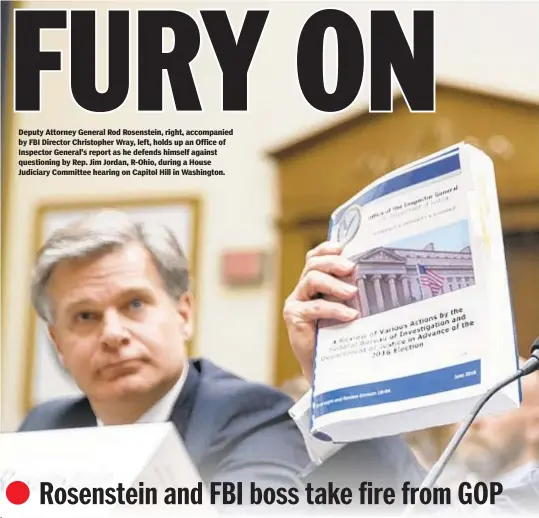  ??  ?? Deputy Attorney General Rod Rosenstein, right, accompanie­d by FBI Director Christophe­r Wray, left, holds up an Office of Inspector General's report as he defends himself against questionin­g by Rep. Jim Jordan, R-Ohio, during a House Judiciary Committee hearing on Capitol Hill in Washington.