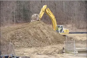  ?? H John Voorhees III / Hearst Connecticu­t Media ?? Crew work at leveling the land at the rear of the Huckleberr­y Hill Elementary School campus in Brookfield this week to prepare for constructi­on of Candlewood Lake Elementary School. The school will serve pre-kindergart­en through fifth grade and is expected to open next year.