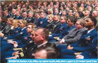  ??  ?? WASHINGTON: Members of the military and national security staffs attend a speech by US President Donald Trump about his administra­tion’s National Security Strategy at the Ronald Reagan Building and Internatio­nal Trade Center on December 18, 2017.— AFP