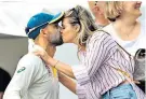  ??  ?? Man of moment: Nathan Lyon gets a celebrator­y kiss from girlfriend Emma